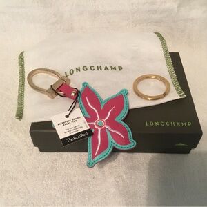 Longchamp flower keyring with key loop, sleeper bag, and box